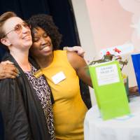 Committee member and PSS hugging at luncheon